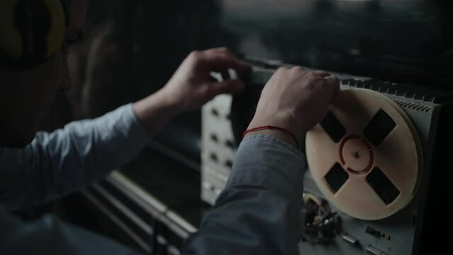 Wiretapping on the reel tape recorder in secret room. Special agent work. Spying conversations. Spy or intelligence gathering. Espionage concept.
