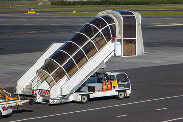 Mobile stairs for boarding and alighting passengers parked at the airport