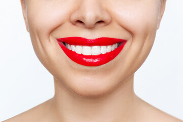 Cropped shot of young caucasian smiling woman with the perfect even teeth isolated on a white...