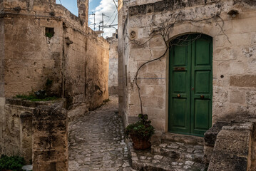 Fototapeta na wymiar Ancient medieval alleyway somewhere in the historic town of Matera, Southern Italy