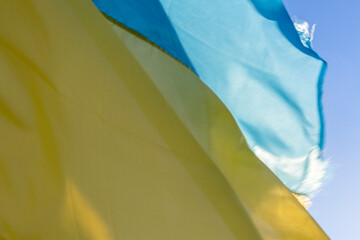 Two flags of Ukraine against the background of the sun, victory in the struggle for independence