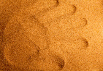Fototapeta na wymiar image of hand trace sand background 