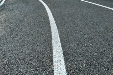 Bicycle treadmill, with white dividing strips, asphalt texture. The concept of the competition.