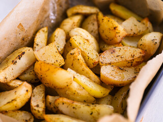 Baked potatoes with spices in an oven dish