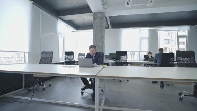 Lazy Employee Playing Video Games On Office Laptop, Ignoring Work And Deadlines