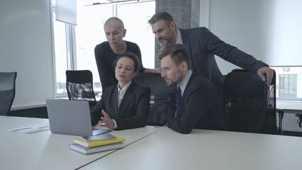 Company team helping colleague resolve work problem together, cooperation