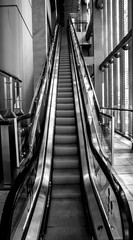 black and white image of a modern escalator in shanghai
