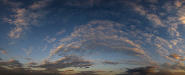 Russia. The South of Eastern Siberia. Gloomy sunset clouds in the evening summer sky over the mountain ranges of Eastern Sayan.