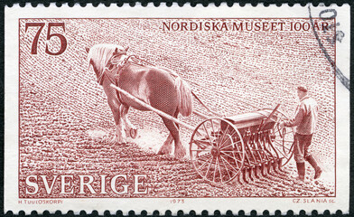 SWEDEN - 1973: shows Man with horse drawn sower, Centenary of Nordic Museum, Stockholm, 1973