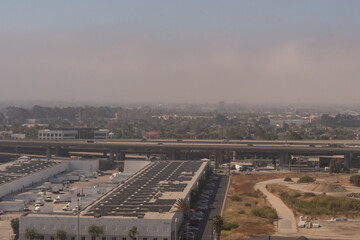 Aerial view of warehouse and elevated highway in Southern California 