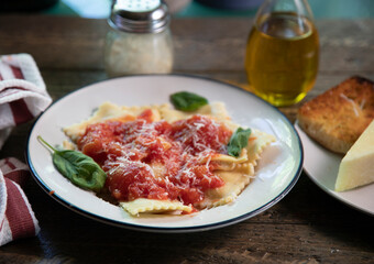 Side  view of  Ravioli dinner on natural wood surface