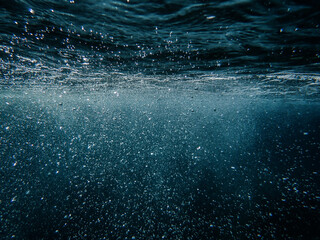 Tropical blue ocean with white bubbles underwater in Mediterranean Sea. Ocean background,...