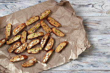 Top view of sliced freshly baked traditional homemade italian sweet cookies cantuccini on the paper...