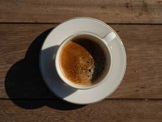 delicious espresso coffee on wooden table