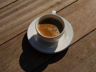 delicious espresso coffee on wooden table