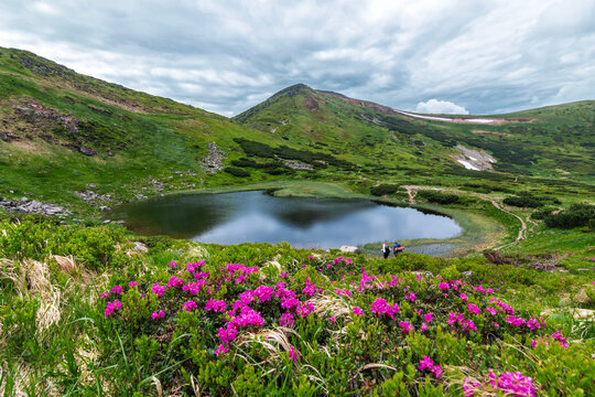 Lake Nesamovyte in the Ukrainian Carpathians. Mount Hoverla hanging peak of the Ukrainian Carpathians against the background of the sky and clouds