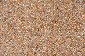 Pebble inlaid concrete sidewalk background texture