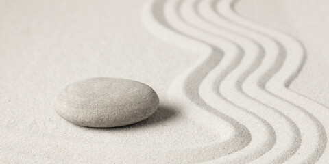 Fototapeta na wymiar Zen stones on sand. Zen garden background scene. 