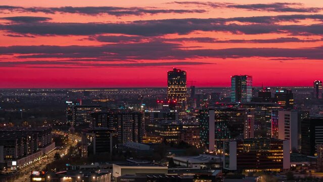 Aerial view of Bucharest skyline at dramatic sunset with colorful sky