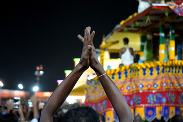 Fototapeta na wymiar Maidan, Kolkata, 01-07-2022. Devotes Clapping With joy in Kolkata Iskcon Rath Yatra 2022