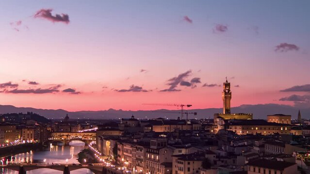 Establishing aerial view of Florence Cathedral, Firenze Cattedrale di Santa Maria del Fiore, Ponte Vecchio and Arno River on a beautiful colourful dusk sky, Tuscany region of Italy Florence