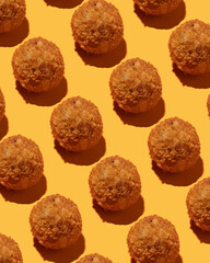 fried cheese balls pattern on a yellow background