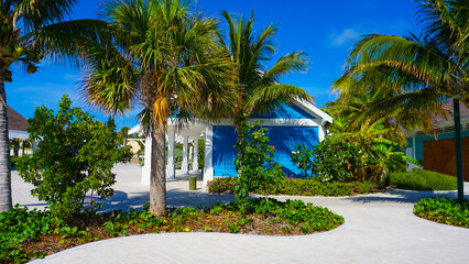 Fototapeta na wymiar Beach on Ocean Cay Bahamas Island with a colorful houses and turquoise water