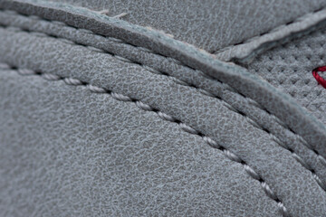 gray sport shoe, stitching detail on sport shoes