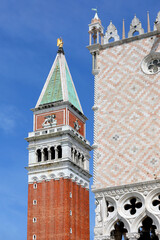 classic glimpse of the island of Venice with the bell tower of San Marco with the golden angel on...