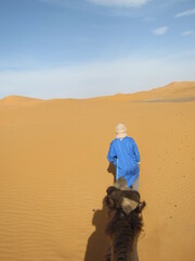 man walking in desert