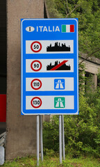 road sign on the border with Italy with the indications of the speed limits in the city on the extra-urban roads and on motorway