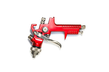 industrial red airbrush on a white background close-up. paint spray tool. isolated on white background