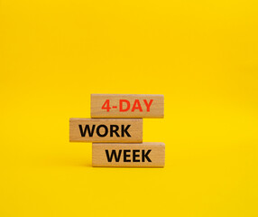 4-day work week symbol. Concept words 4-day work week on wooden blocks. Beautiful yellow background. Business and 4-day work week concept. Copy space