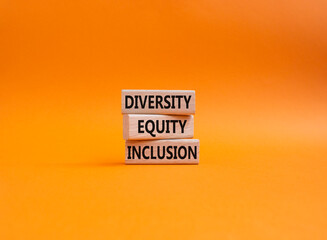 Diversity Equity Inclusion symbol. Concept words Diversity Equity Inclusion on wooden blocks. Beautiful orange background. Business and Diversity Equity Inclusion concept. Copy space