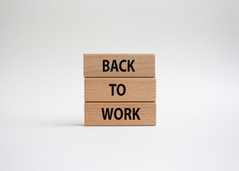 Back to Work symbol. Wooden blocks with words Back to Work. Beautiful white background. Business and Back to Work. Copy space.