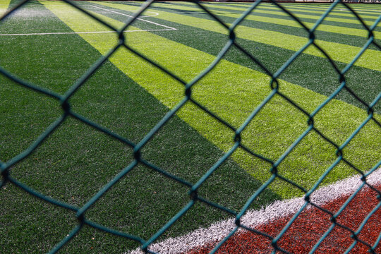 Soccer or football field behind the fences. Banned from football concept