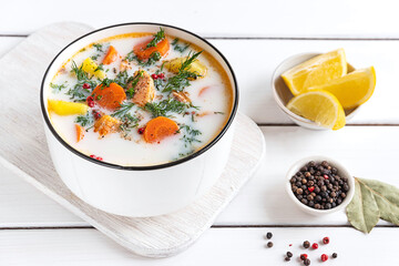 Lohikeitto, Finnish creamy salmon soup in a white bowl