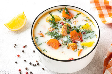 Lohikeitto, Finnish creamy salmon soup in a white bowl