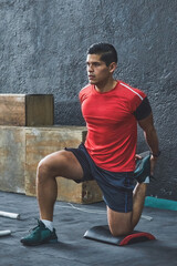 Fototapeta premium Latin young man doing his warm-up routine