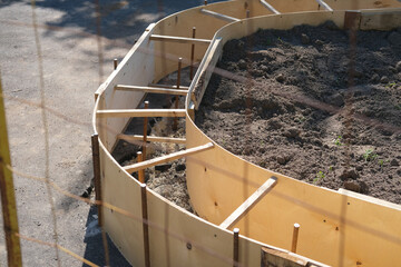 plywood formwork for landscaping and creating urban flower beds - obrazy, fototapety, plakaty