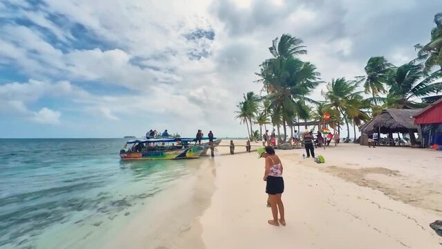 Tourist walk pov on tropical Island San Blass with amazing sand beach and palm trees