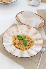 Traditional authentic italian pasta in a restaurant on a white served table. Italian traditional cuisine