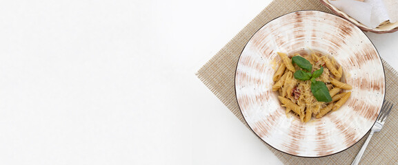 Traditional authentic italian pasta in a restaurant on a white served table. Italian traditional cuisine