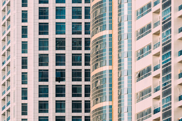 Obraz premium Wall With A Balcony Of New Empty Modern Multi-storey Residential Building House In Residential Area. Background. Close Up.