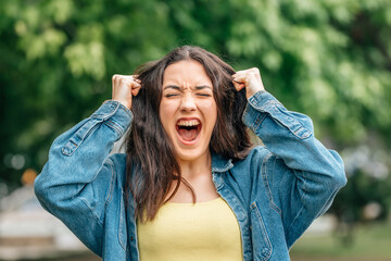 desperate girl screaming furious outdoors