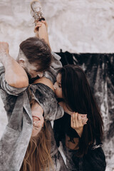 Family photo shoot in nature. concept of happy childhood for children. Problems and difficulties of raising children and the joy of care and parenthood for a young family