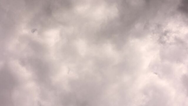 Footage B Roll Timelapse blue Sky and gray cloud. Dark cloudy day sunlight in the atmosphere in hot weather. Beautiful nature time lapse rainy clouds at sunset time. Heavenly cloud sky nature scenery.