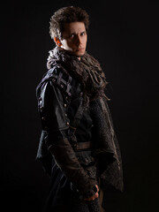 A guy in a steampunk or post-apocalyptic image, portrait on a black background