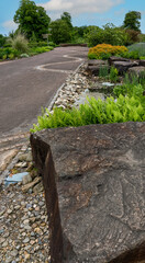 close up of large Welsh Granite blocks used as architectural feratures in a botanical garden 