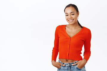 Smiling black woman in red blouse, looking happy, casual pose, white background